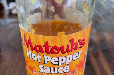 Just had this for the first time. It is made with Scotch Bonnet peppers, which had a great flavor and a good amount of heat!