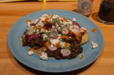 Arepas, black beans, and salsa verde