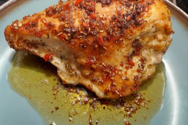 Roasted and deglazed chicken breast with garlic, butter, finely chopped fresh picked ghost peppers I grew.