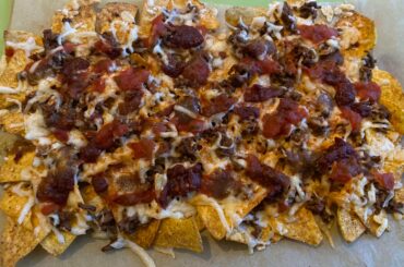 I give you the Nachos of Indecision: Mrs. Renfro’s reaper salsa, Hotter Than El’s Reaper Revenge, El Yucateco Kutbil-ik, chipotle paste, and some hot smoked Hungarian paprika powder for good measure. (Rest of the condiments went on afterwards)