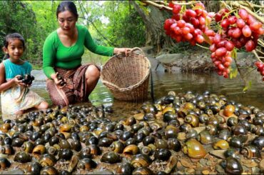 Pick snail and grape fruit near river- Mother cooking snail spicy chili eating with daughter