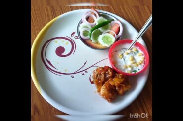 chili chiken, raita, salad, fried rice and tandoori roti