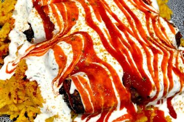 Lamb kofta kebabs over chicken flavoured rice with my own halal guys white sauce and Tabasco sriracha