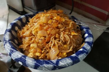 Rice noodles, pan fried with onion and egg. And most every pepper I could find around the kitchen.