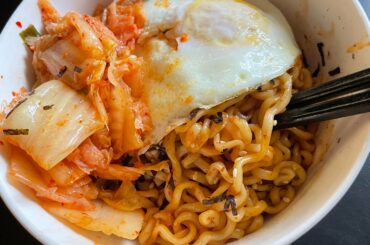 Buldak spicy chicken ramen with kimchi and a fried egg.