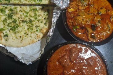 Lamb vindaloo, lamb madras, and garlic chili naan