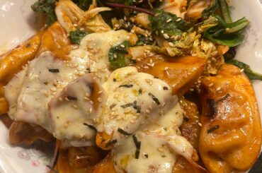 Dumplings in Samyang 2x Spicy Sauce with Kimchi/Greens and Melted Ghost Pepper Cheese