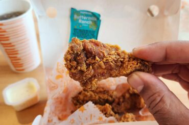 Popeye's has "Ghost Pepper" wings. They are not particularly hot, but they are really delicious. I would tell you to try them, just don't expect heat, but they taste great.