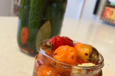My first time quick pickling ghost peppers and habaneros! Hope they turn out yum!(also tried quick picking cucumbers with habaneros in the back).