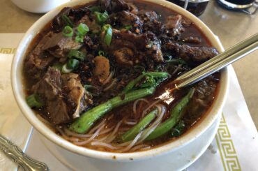 an order of chili oil with noodle as sides
