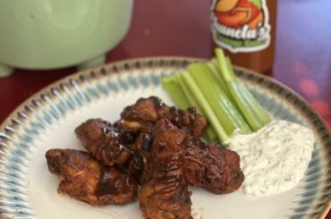 Spicy taco chicken wings with celery and homemade blue cheese dip