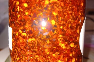 Made chili oil with red pepper flakes, ancho pepper chili, chili de arbol and garlic.