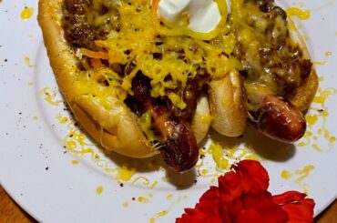 A pair of chili dogs