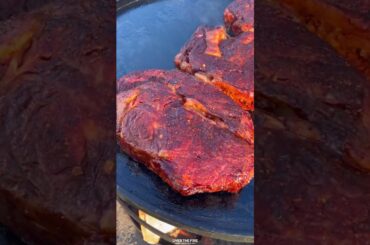 Coffee Crusted Ribeyes with Honey Chili Butter | Over The Fire Cooking by Derek Wolf