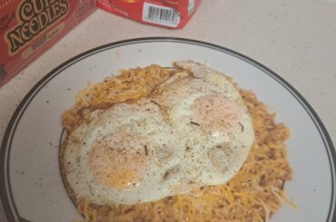 Cheesey Korean fire noods w fried eggs on top (bussin, on god. NOT CAPPING)