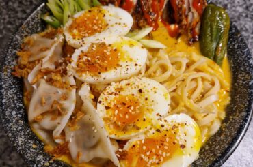 2x Samyang, chilli oil, miso and sesame paste broth, samyang gyosas, chilli rub chicken thigh, a roasted green chilli (cause why not) and some eggs (: pretty hot!