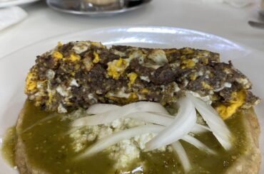 Huevos tiradas on picadas with salsa verde and lechero (in the background) at La Parroquia, Tuxpan, Ver.