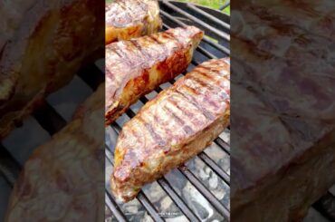 Grilled NY Strips with Garlic Chili Sauce Recipe | Over The Fire Cooking by Derek Wolf