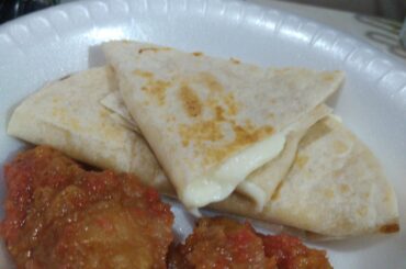 Oaxaca cheese flour quesadillas and chicharron in red sauce (tomato, garlic and habanero only)