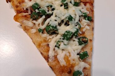 Leftover slice of cheese pizza with 3 Thai bird's eye chilis and extra shredded parm