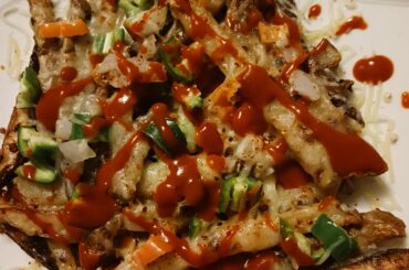 Homemade cheese fries with Valentina, serranos, and habaneros