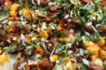 Al Pastor Pizza Double-decked flour tortilla crust, chihuahua cheese, mexican marinara, onions, cilantro, charred pineapple, chile marinated pork.