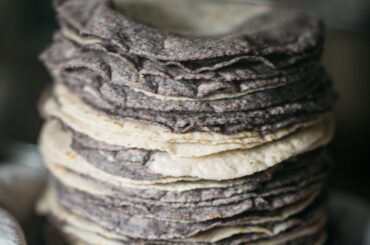 Fresh stack of stone ground mixed masa tortillas. A true delicacy here up north in the states.