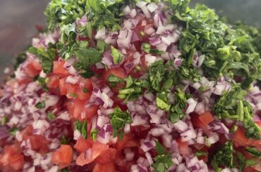 Hand-cut pico de gallo to top some smoked pork and chicken with a bit of guac. Fed a crowd of 20!