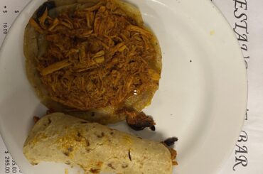 Delicious cochinita taco y panucho washed down with a reposado in CDMX