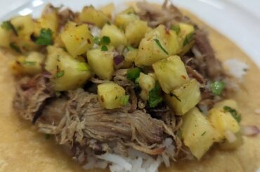 Smoked, pulled pork with grilled pineapple salsa on freshly fried tortillas.