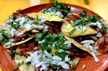 Al pastor tacos with cilantro onion and pineapple. Tacos Nelly Mexico City.