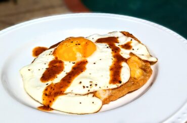 Chalupa with egg, cheese and La Perrona roasted chiltepin hot sauce
