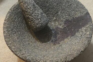 How do I clean a molcajete and get rid of this purple stain inside the bowl?