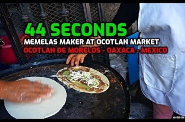"memela" is an elliptic corn tortilla bigger than the regular tortilla and is topped with refried beans, cheese, sauce and sometimes meat like this one at Ocotlan market, Oaxaca, Mexico
