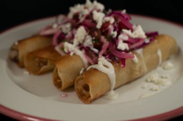 Another British attempt at Mexican cuisine. Chicken flautas topped with a spicy cabbage salad (red and white cabbage, onion, tomato, green chilli, habanero, cilantro/coriander and lime juice). Had to switch crema and queso fresco for creme fraiche and feta, due to availability. Did I do ok?