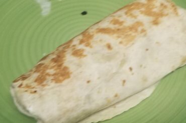 Can anyone identify this? I ordered a grilled cheese chicken burrito and got home and found this instead. I'm not happy obviously, and how anyone could mistake that for this?