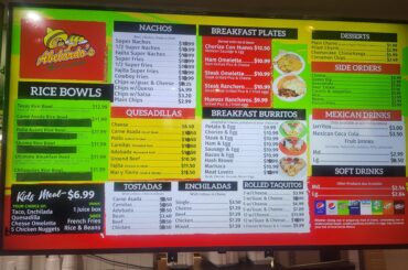 This Abelardo's doesn't know how to change their prices on the computer so they use stickers to update their prices instead.