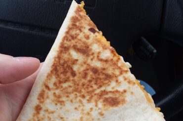 Having a cheese quesadilla on my way to work.