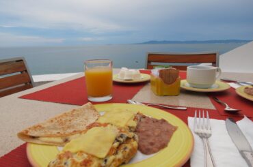 omelette, quesadilla, beans and juice
