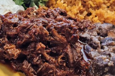 Fandango Chile Colorado with Rio Zape beans, rice, cilantro, crema and corn tortillas