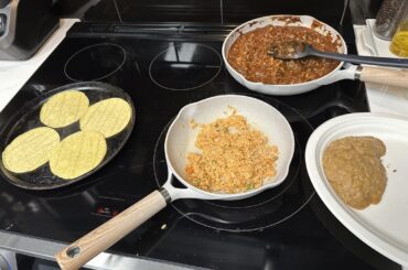 Chicken mole, Mexican rice, refried beans and corn tortillas