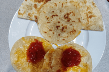 Corn and flour quesadillas with a bit of red and Herdez guacamole sauce