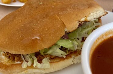White guy trying a Sinaloense-style torta ahogada, it was ok