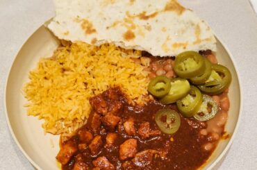 Asado de Puerco with rice and beans on the side