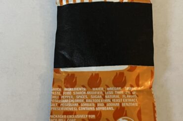 Sauce Packet with black tape on the front of it?