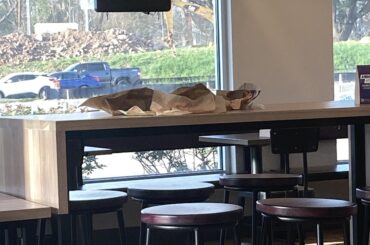 Older gentleman waiting for their waiter to pickup after him