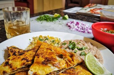 Birria quesadillas with rice and beans.