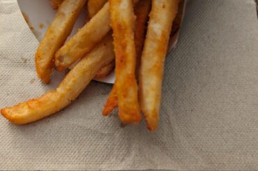 Weight of my large fries (with container and one napkin) was 5.8oz.   Is this normal/high/low?  Any other data points?