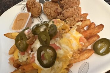 Chicken nuggets and Secret Aardvark Nacho Fries