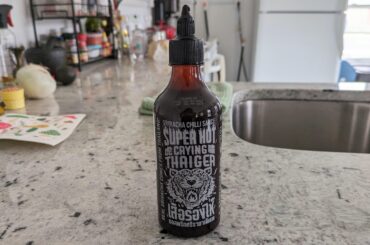 About half as hot as Samyang with a deeper tangier sriracha flavor than the typical